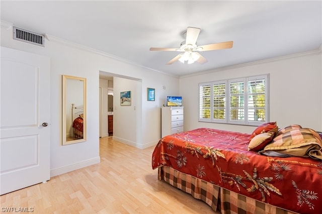 bedroom with ensuite bath, ornamental molding, light hardwood / wood-style floors, and ceiling fan