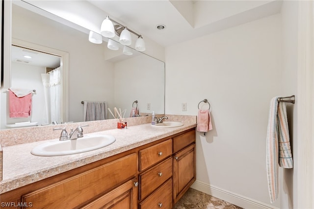 bathroom with double sink, tile flooring, and oversized vanity