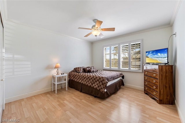 bedroom with crown molding, light hardwood / wood-style floors, and ceiling fan