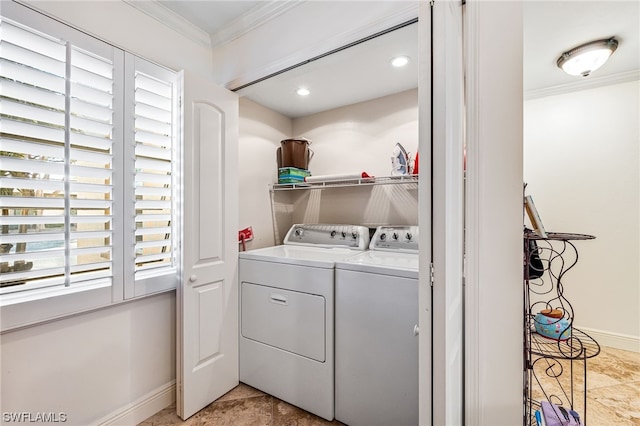 laundry area featuring light tile floors, washing machine and dryer, and ornamental molding