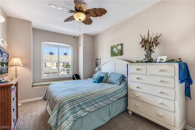 bedroom with dark carpet and ceiling fan