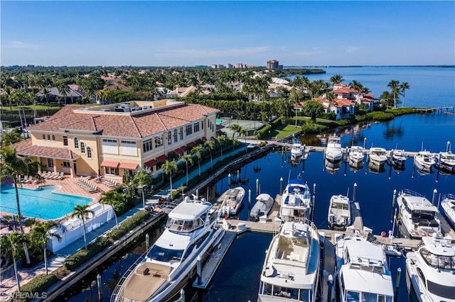 birds eye view of property with a water view