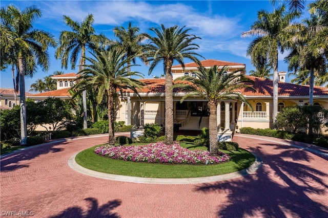 mediterranean / spanish-style house with a porch