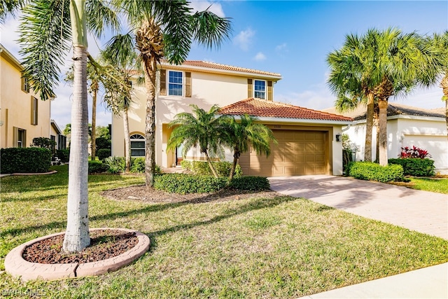 mediterranean / spanish-style home featuring a front yard and a garage