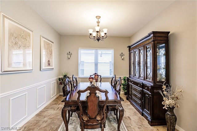 tiled dining area with a notable chandelier