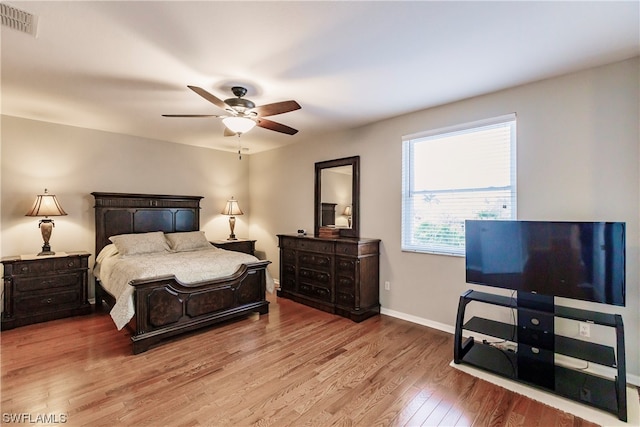 bedroom with wood-type flooring and ceiling fan