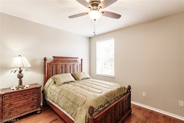 bedroom featuring ceiling fan and dark wood-type flooring