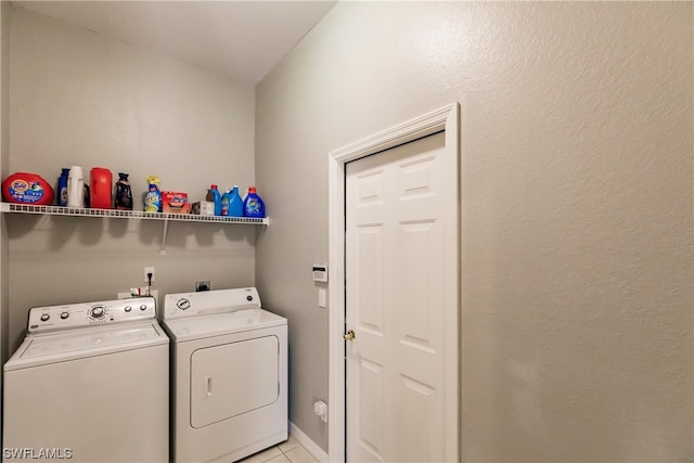 laundry room featuring light tile floors, electric dryer hookup, and washer and dryer