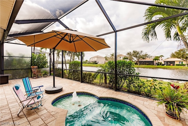 view of pool with glass enclosure, a water view, a hot tub, and a patio