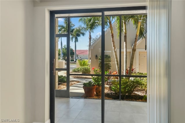 doorway with light tile flooring