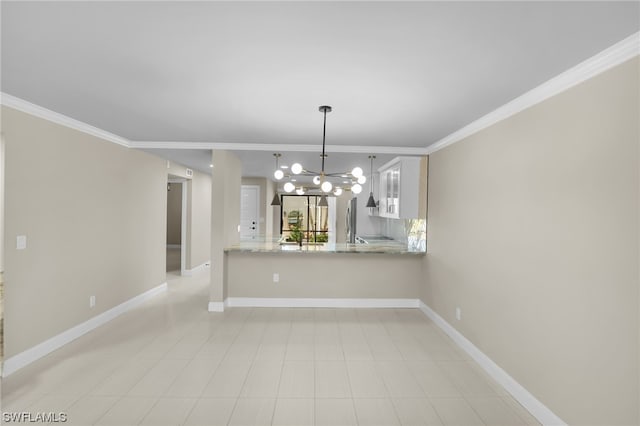 interior space featuring ornamental molding and an inviting chandelier