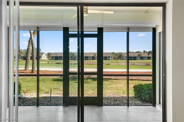 entryway with plenty of natural light and light tile floors