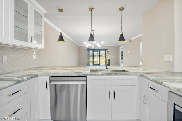 kitchen featuring white cabinets, hanging light fixtures, dishwasher, and sink