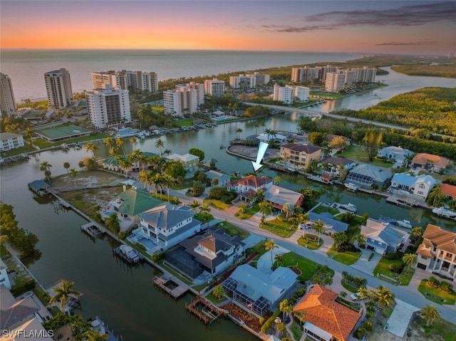 aerial view at dusk with a water view