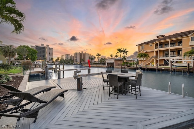 exterior space featuring a water view and a boat dock