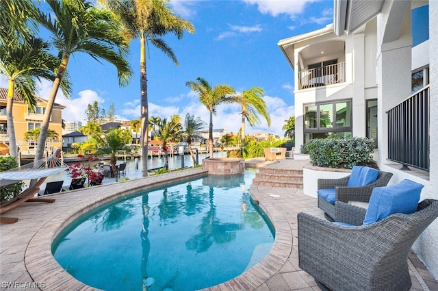 view of swimming pool with a patio