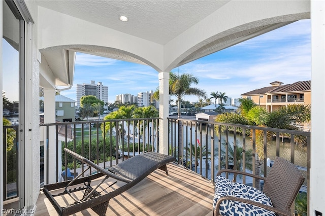 balcony featuring a water view