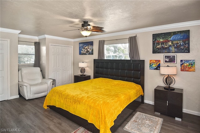 bedroom featuring ceiling fan, dark hardwood / wood-style flooring, a textured ceiling, a closet, and ornamental molding