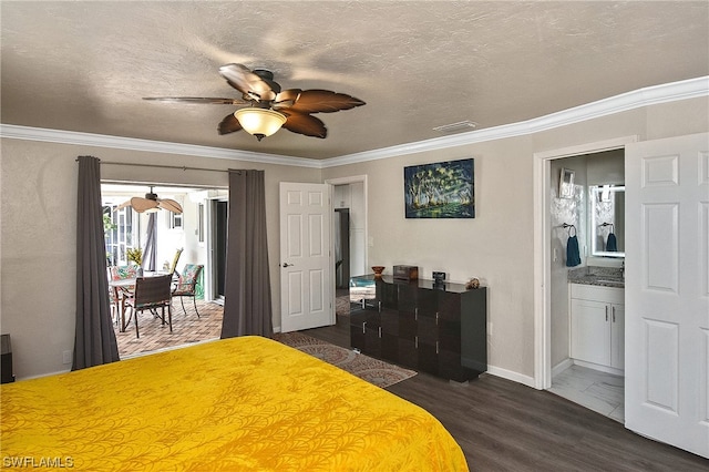 bedroom with dark wood-type flooring, crown molding, ceiling fan, a textured ceiling, and connected bathroom