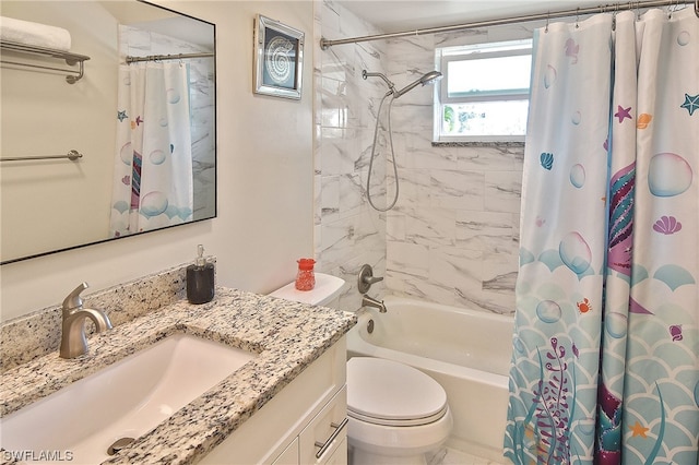 full bathroom with vanity, shower / tub combo, and toilet