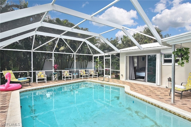 view of pool featuring a lanai and a patio