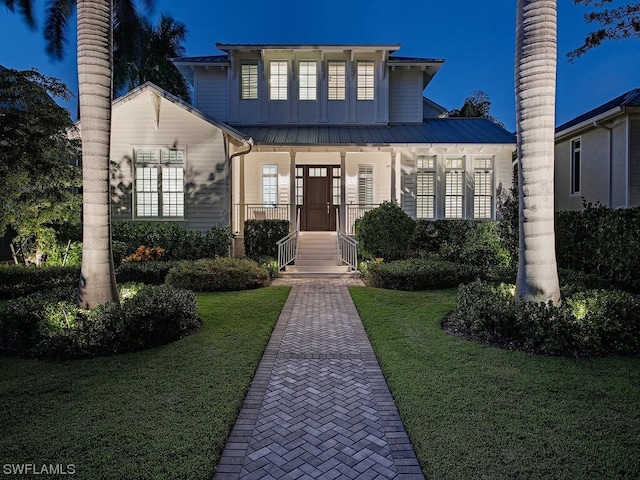 view of front of property with a yard