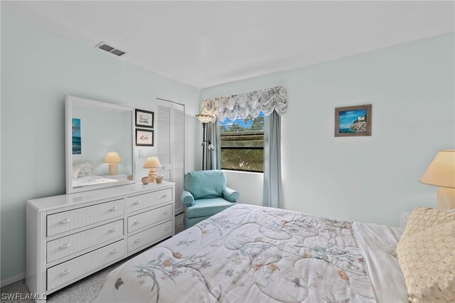 carpeted bedroom featuring a closet