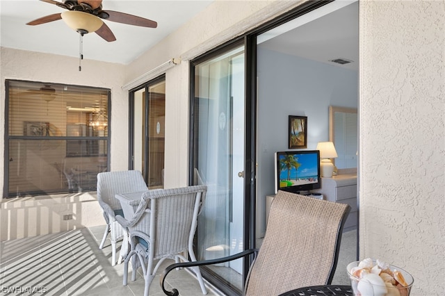 balcony featuring ceiling fan