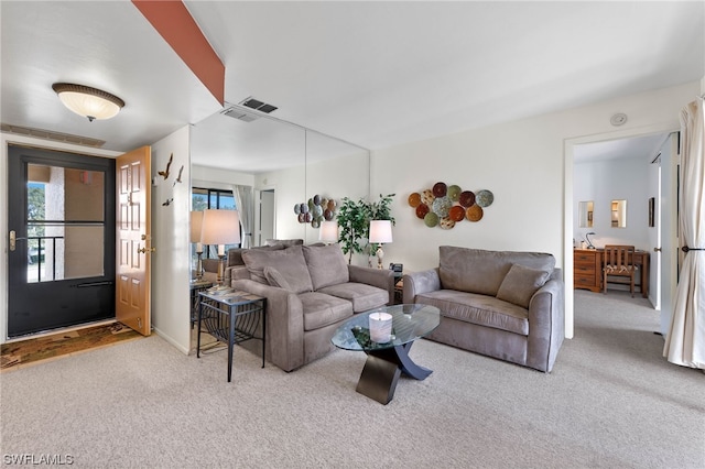 living room featuring light carpet