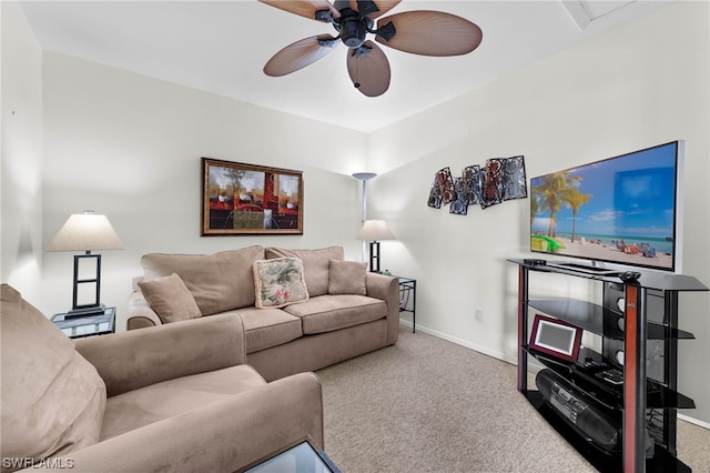 carpeted living room with ceiling fan