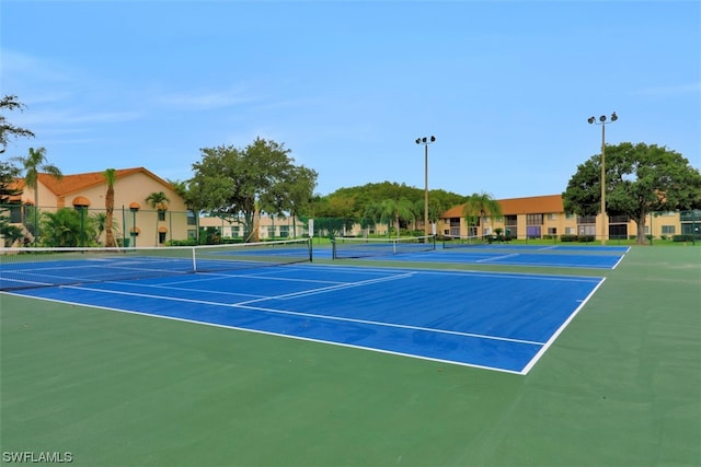 view of sport court featuring basketball hoop