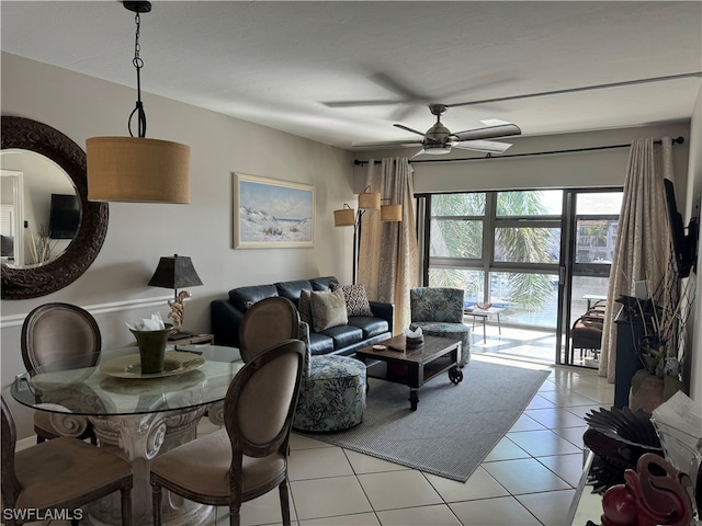 living room featuring ceiling fan and light tile floors