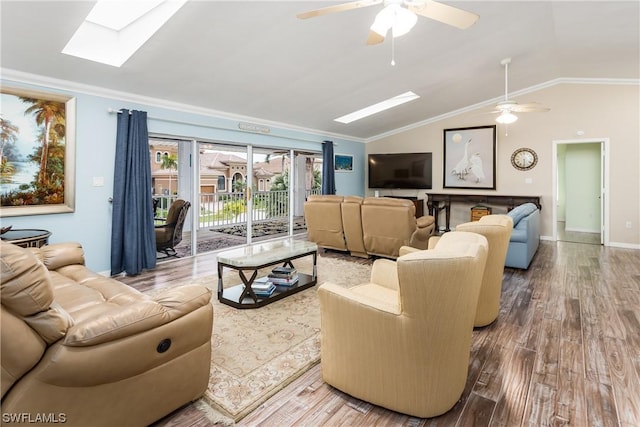 832 Swan Dr, Marco Island, FL 34145 - living area with lofted ceiling with skylight, wood finished floors, ornamental molding, and ceiling fan