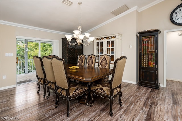 dining area with crown molding, dark hardwood / wood-style floors, vaulted ceiling, and a chandelier