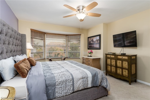 bedroom with light carpet and ceiling fan