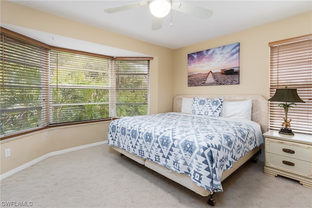 bedroom featuring ceiling fan and light colored carpet