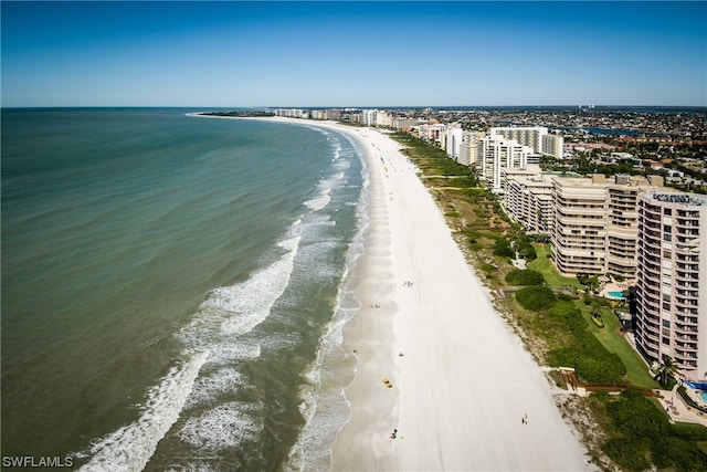 birds eye view of property featuring a water view and a view of the beach