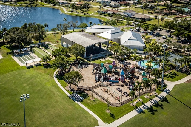 birds eye view of property with a water view