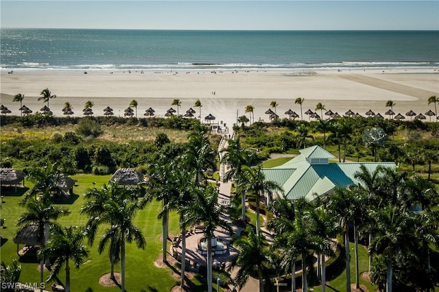 drone / aerial view with a beach view and a water view