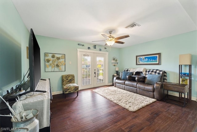 living room featuring dark hardwood / wood-style floors, ceiling fan, and french doors