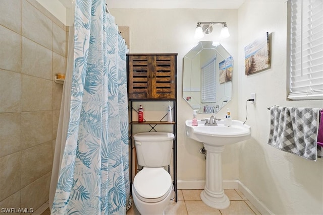 bathroom featuring toilet and tile flooring