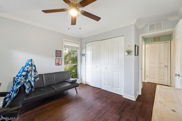 interior space featuring dark hardwood / wood-style floors, ceiling fan, and ornamental molding