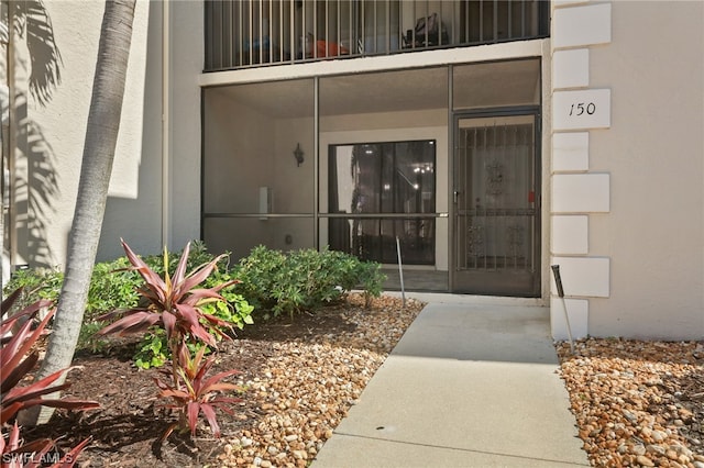 doorway to property featuring a balcony