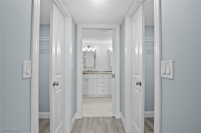 corridor featuring light tile flooring