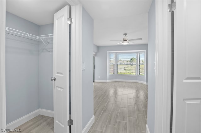 interior space featuring ceiling fan and light hardwood / wood-style flooring