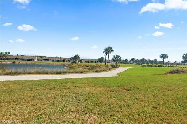 exterior space with a yard and a water view