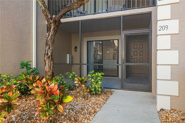 doorway to property featuring a balcony