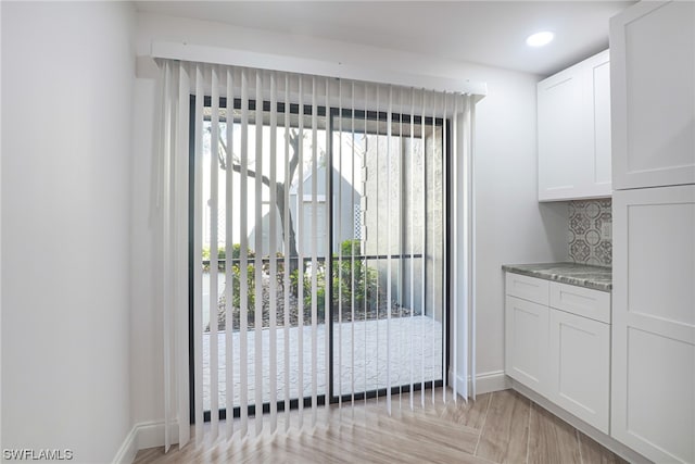 entryway with light parquet flooring and a healthy amount of sunlight