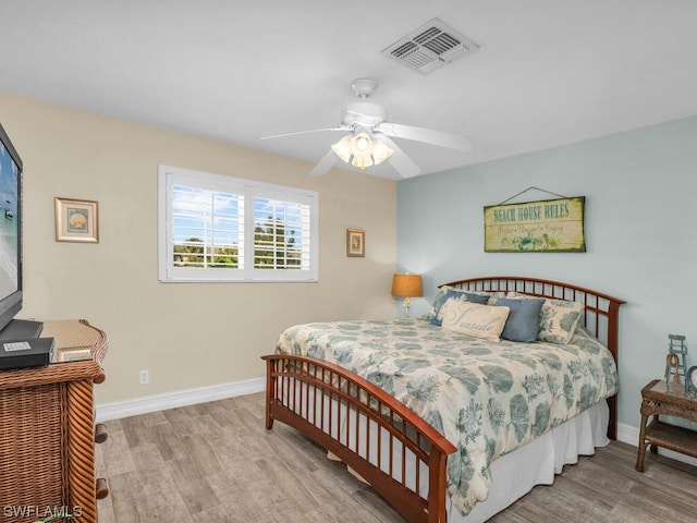 bedroom featuring ceiling fan and light hardwood / wood-style flooring