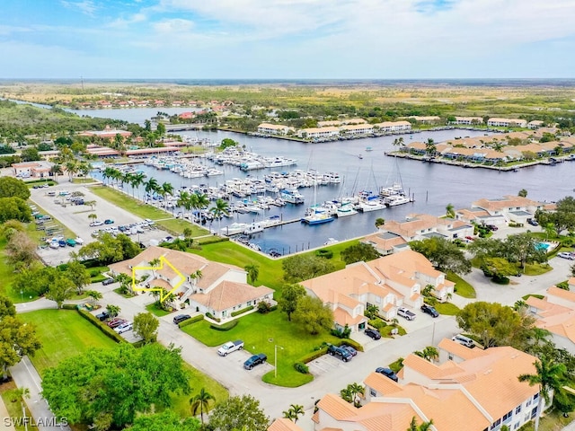 birds eye view of property with a water view